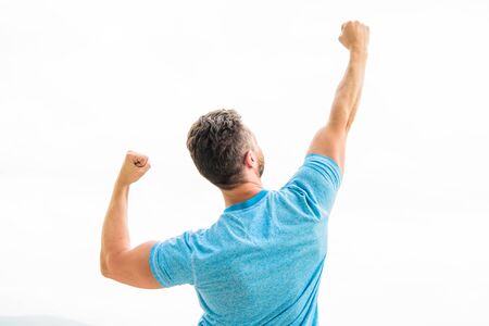 Strong muscular body feeling powerful rear view. Successful athlete. Victory and success. Future opportunity. Leadership and competition. Looking forward in future. Champion winner. Future concept.の写真素材