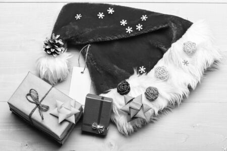 Santa hat and christmas gift box. Christmas presents from santa. Santa hat white background top...