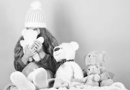 Happy childhood concept. Child small girl playful hold teddy bear plush toy. Why kids love stuffed animals. Kid little girl play with soft toy teddy bear on pink background. Toy every child dreaming.の写真素材