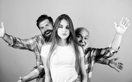 Internal demons. conscience and repentance. two bearded men scare and chase young woman. family values. generation and gender concept. relationship. fashion style. psychology of consciousnessの写真素材