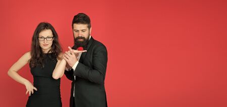 Engagement concept. Couple in love celebrate anniversary. Romantic gift box jewelry engagement. Marriage proposal. Handsome man and elegant woman in love. Romantic engagement. Proposal engagementの写真素材