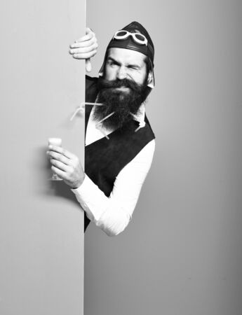 funny handsome bearded pilot or aviator man with long beardの写真素材