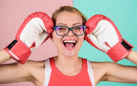 Cute boxer girl. see the success is near. sexy and confident secretary. choose healthy way of life. she loves sport. huge sense of self confidence. woman in glasses and boxing glovesの写真素材