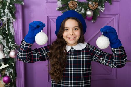 wonderland of snow. parisian girl in beret and gloves. winter holiday activity. season shopping. small french girl. stylish kid decorative xmas ball. decorate home and christmas tree. happy new yearの写真素材