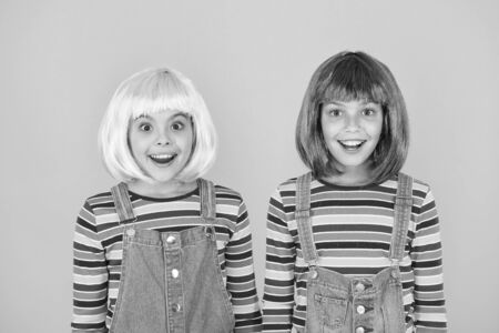 Anime convention. Happy little girls. Anime fan. Cheerful friends in colorful wigs. Anime cosplay party concept. Animation style characterized colorful graphics vibrant characters fantastical themesの写真素材