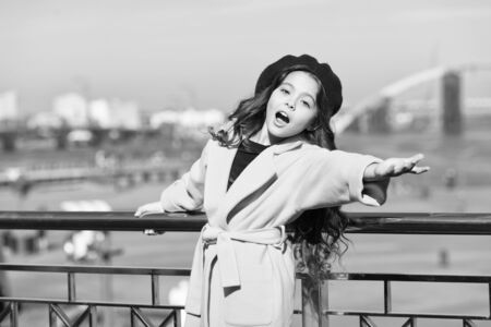 sense of freedom. trip to france. enjoy autumn day. lucky with weather. happy little lady. small girl outdoor. french style. true parisian. girl child after hairdresser. she has unreal curly hairの写真素材