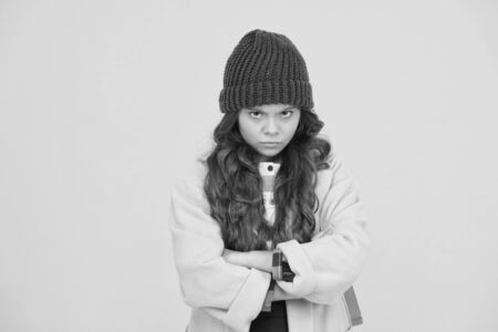 I hate school. Unhappy child on yellow background. Cute little child wear formal school uniform. Adorable small girl with long curly hair in autumn fashion. Child say no to schoolの写真素材