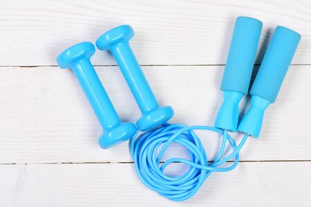 Active lifestyle and workout concept. Sports equipment in cyan blue
