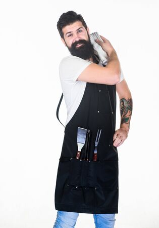 Picnic and barbecue. How choose meat for steak and barbecue. Barbecue menu. Bearded hipster wear apron for barbecue. Roasting and grilling food. Tips cooking meat. Tools for roasting meat outdoorsの写真素材