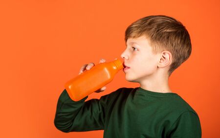 Healthy and yummy. Little child drink fruit juice. Good health habits. Juice recipe for health. Healthy nutrition for kids. Health benefits. Juicing for health is easy way to take in nutrientsの写真素材