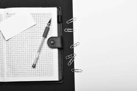 Blank cards, pen, paper clips and organizer, top view. Stationery and leather covered notebook with copy spaceの写真素材