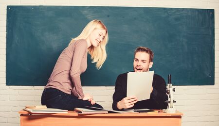 Students in classroom chalkboard background. Education concept. College entrance exam. Prepare final exam. Students study before exam. ertificate proves successfully passed university entrance examの写真素材