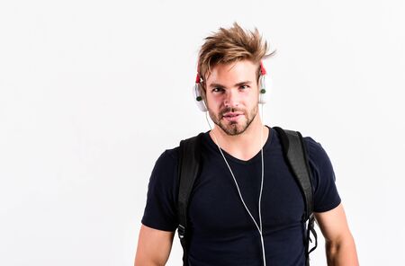 I am online. new technology in modern life. sexy muscular man listen music. man listen new song isolated on white. unshaven man in blue tooth technology earphones. moder life conceptの写真素材
