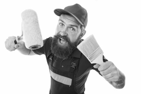Painting works. Bearded laborer. Repair and renovation. Repair tips. Engineer architect. Man worker with paint roller. Builder regular worker hold tools. Quick repair. Allow decorator be creativeの写真素材