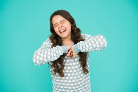 Pure beauty. Little girl sneeze blue background. Beauty look of small fashion model. Fashion and...