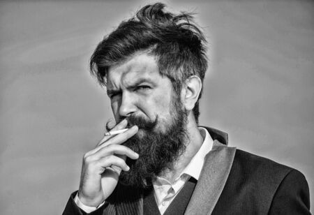 Looking for inspiration. Businessman against the sky. brutal caucasian hipster with moustache....