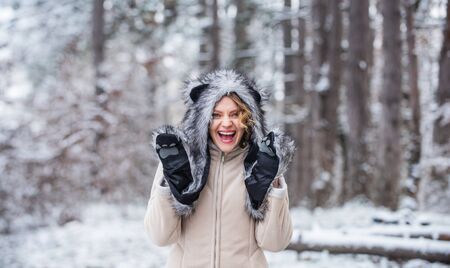 Girl in mittens and fur hat. funny and happy woman. best holiday ever. girl wear warm clothing....