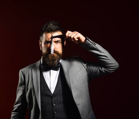 Macho in formal suit shaves beard. Business and barbershop service