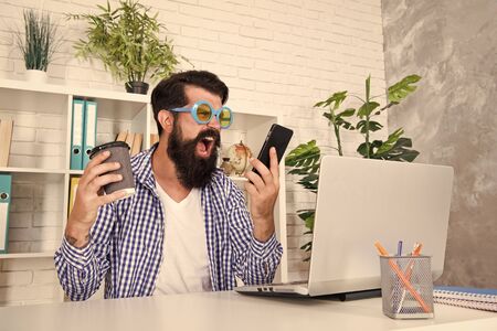 Man freak crazy office manager having phone call while drinking coffee. Productive day. Freak...