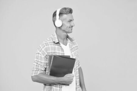 Another way of study. Man handsome college student headphones books. Study languages. Learning english. Educational technology. Study. Audio book concept. Worldwide knowledge access. Audio libraryの写真素材