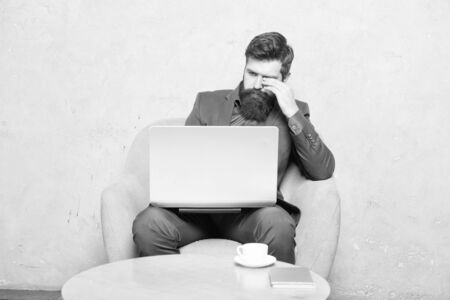A successful business relies on technology. Businessman working at laptop technology for running business. Bearded man using technology in communication with customer. Business technologyの写真素材