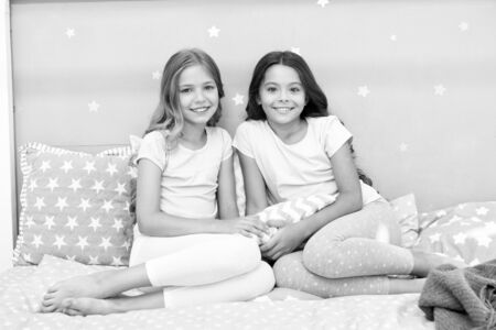 Soulmates girls having fun sleepover party. Childhood friendship concept. Girls happy best friends sleepover domestic party. Sleepover time for fun gossip story. Best girls sleepover party ideasの写真素材