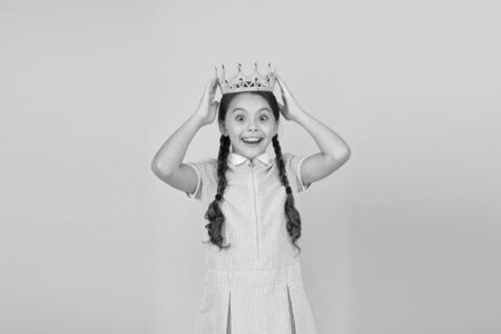 Luxury Everyone can Afford. reward for best winner. small egoist girl imagine she is princess. luxury and future success. happy childhood. prom queen. retro selfish girl. vintage girl in gold crownの写真素材