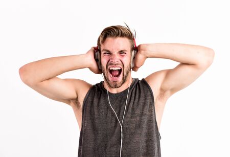 Man handsome unshaven hipster listening song using headphones gadget white background. Enjoy every...