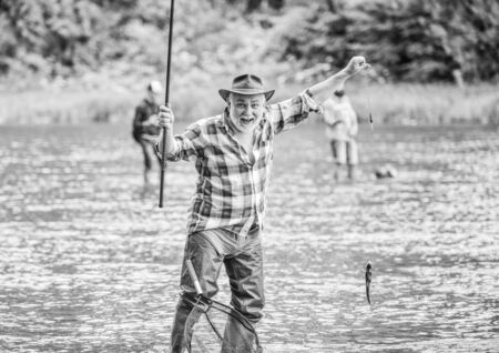 best moment. mature man fishing. summer weekend. fisherman with fishing rod. pothunter. man catching...