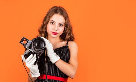 capture childhood memories. SLR camera. beautiful child photographer hold retro camera. journalist...