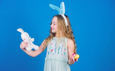 The Easter bunny is coming. Easter bunny rabbit. Little girl and rabbit toy. Small girl in rabbit...