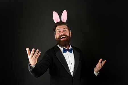 Celebration Easter holiday. Easter day. Event host. Celebrate Easter. Let me be your bunny. Bearded man with long ears. Businessman with long ears. Handsome man wear bunny costume accessoryの写真素材
