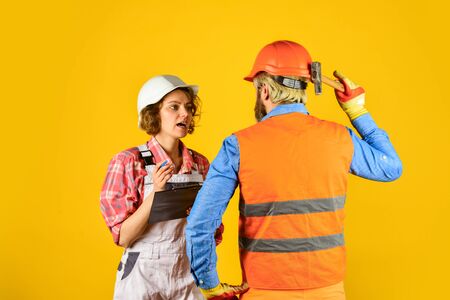 teamwork. family standing inside house under construction. renovation and people concept. Builder...