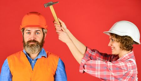 feel protected. Portrait of family wearing hardhat. Construction worker in protective helmet. repair and building. real estate deal. couple of architect wear hardhat. new house construction conceptの写真素材