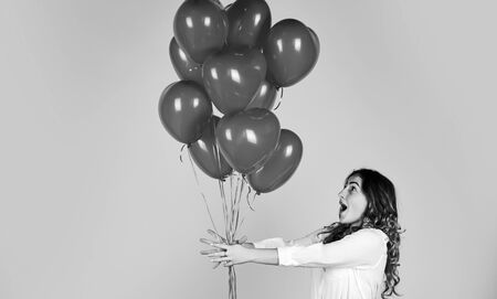 happy valentines day. girl got heart balloon from valentine. love and joy. happy woman air balloon...