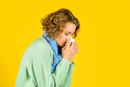 sneezing in napkin. Symptoms of disease. runny nose caused by illness. ill with laryngitis. Acute...