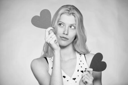 Woman hold heart valentines decoration. Love and romance. Valentines day discount. Valentines day shopping. Guess what he gifted to me. Celebrate valentines day. Girl romantic mood dream about dateの写真素材