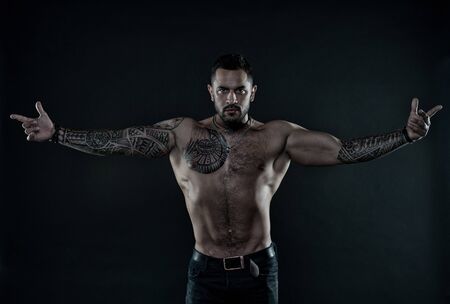 Sexy naked torso with six pack abs. Sport workout bodybuilding concept. shirtless macho man. Fashion portrait of brutal sporty guy. Sport and fitness. Man with tattooed body. welcome to my worldの写真素材