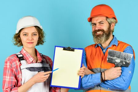 couple discussing blueprint at home. real estate deal. talk about interior decoration. under...