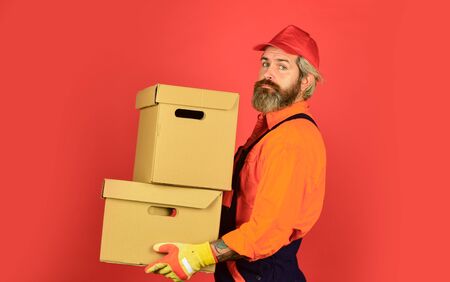 Service delivery. Delivering purchase. Shopping. Bachelor day. Fast shipping. Post worker. Delivered to your destination. Courier and delivery. Postman delivery worker. Handsome man red capの写真素材