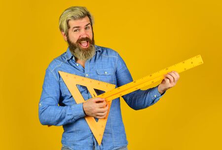 Free education. Teaching geometry. Long or short. Bearded man use ruler. Education concept. School...