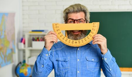 School education. study algebra in college. formal sciences. happy mature teacher in glasses. back to school. man engineering graphics and projects. science in modern school. Math is favorite subject.の写真素材