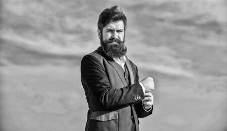 Success concept. brutal caucasian hipster with moustache. Bearded man. Future success. Confident and successful. formal fashion. Businessman on sky. Mature hipster with beard. Celebrating successの写真素材