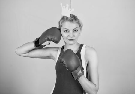 Queen of sport. Become best in boxing sport. Feminine tender blonde with queen crown wear boxing...