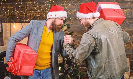 Get ready for christmas. Men wear santa hat hold gift boxes. Bearded men carry present boxes. Brutal...