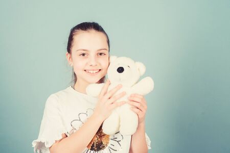 Imaginary friend. Little girl play with soft toy teddy bear. Happy childhood. Child care. Sweet...