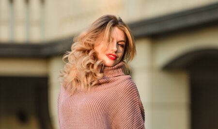 Enjoy softness. Blonde girl make up face in fall outfit. Knitwear concept. Vogue model. Cashmere woolen sweater. Warm oversized sweaters. Woman wear sweater. Elongated sweatshirt tunic or dressの写真素材