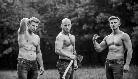no pain no gain. Brutal macho style. Strong men are sexy. showing abs. full of energy. Inspiring better health. muscular men with axe. athletic man use ax. sport concept. Sexy men with muscular torsoの写真素材