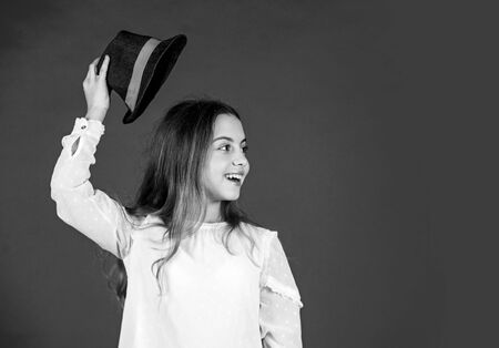 Protect scalp sun rays. Fancy girl. Spring outfit. Individual style. Girl wear hat red background. Happy kid in hat. Fashion accessory. Summer accessory collection. Child wear hat. Accessories shopの写真素材