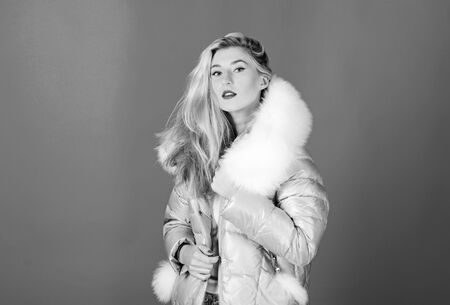 Winter clothes. Down jacket with furry hood. Girl wear winter jacket. Winter season. Soft fur. For those wishing stay modern. Fashion environmental awareness. Faux fur is more than just trendの写真素材